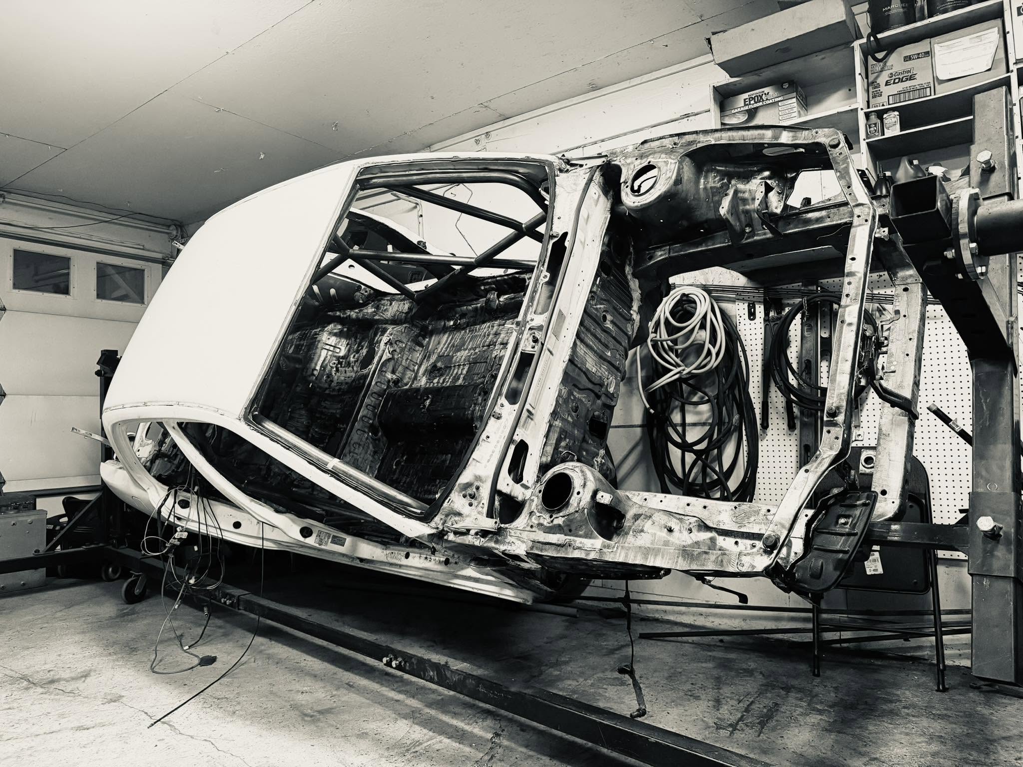EVO III shell on rotisserie during body work stage